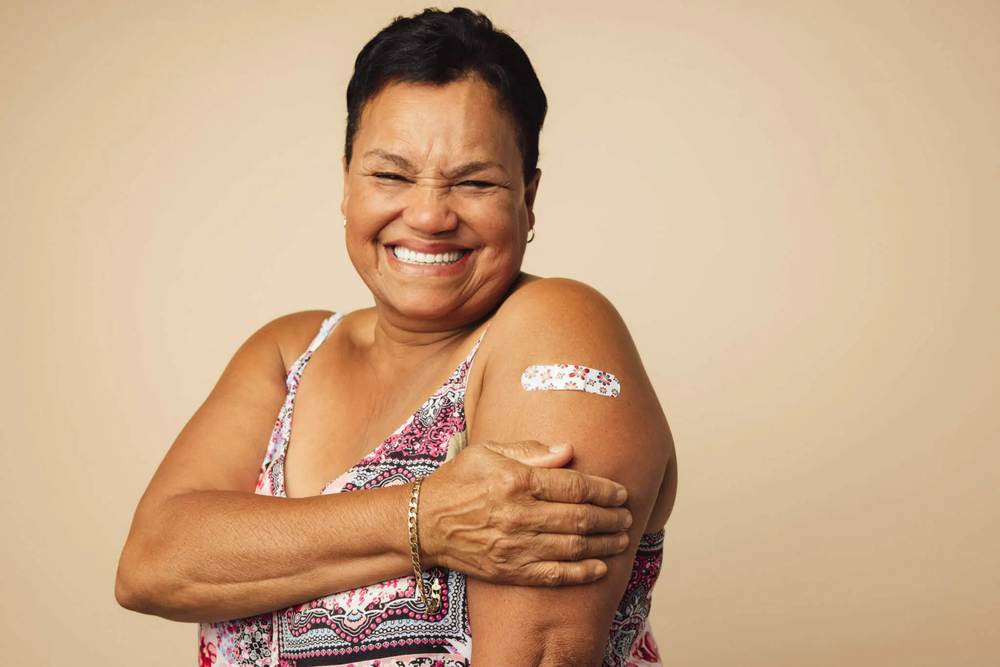 Senior smiling after vaccination