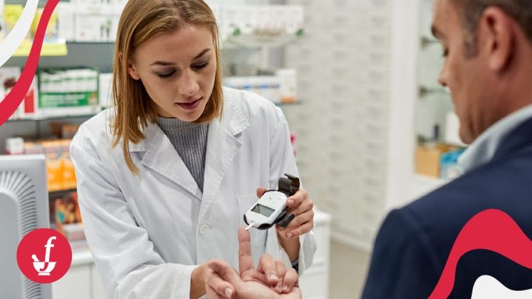 woman pharmacist takes the blood pressure of a man